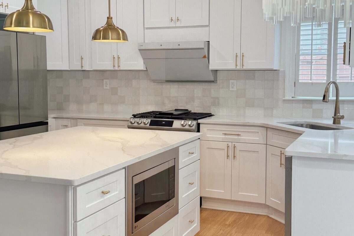 White Shaker cabinets with Gold hardware Kitchen