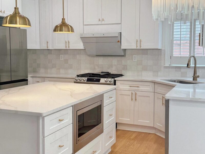 White Shaker cabinets with Gold hardware Kitchen