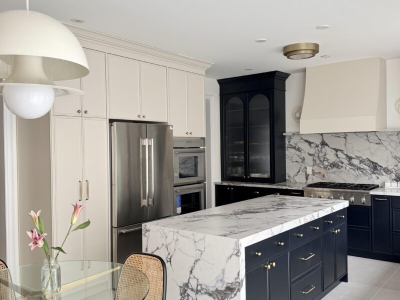 Black Cabinets With Taj Mahal Countertop