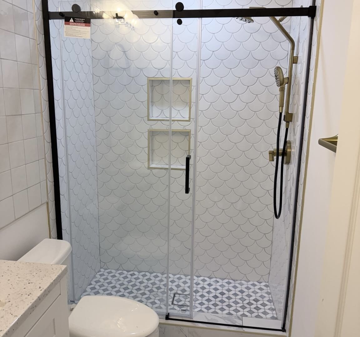 Timeless Serenity: Bathroom with a Sliding Glass Shower Door